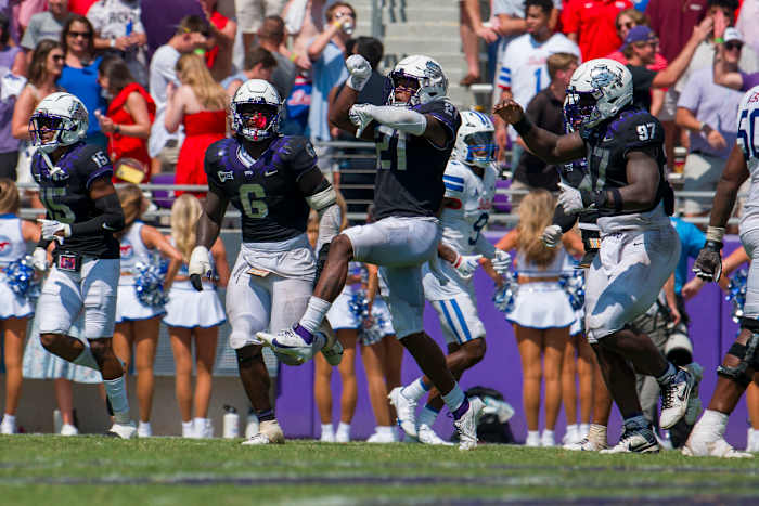 Sep 23, 2023; Fort Worth, Texas, USA; TCU Horned Frogs safety Bud Clark (21) and the Horned Frog defense celebrate after Clark intercepts an SMU Mustangs pass during the second half at Amon G. Carter Stadium. Mandatory Credit: Jerome Miron-USA TODAY Sports